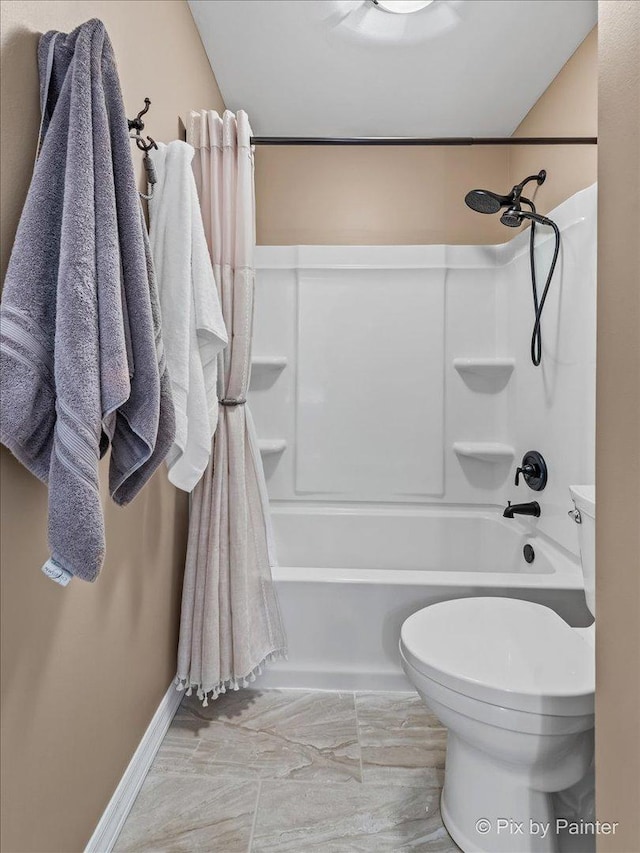 bathroom featuring toilet and shower / washtub combination