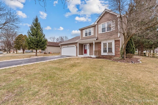 front facade featuring a front yard and a garage