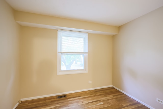 unfurnished room featuring wood-type flooring