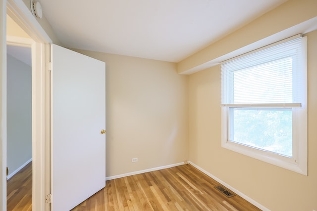 spare room featuring light hardwood / wood-style flooring