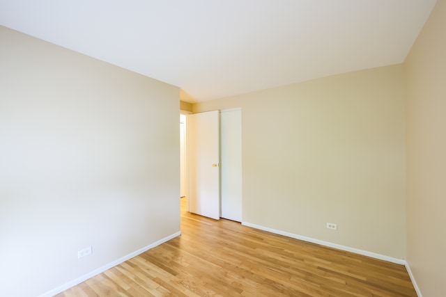 spare room with light hardwood / wood-style floors