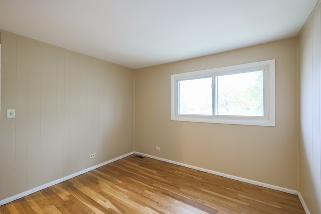 unfurnished room featuring light hardwood / wood-style flooring