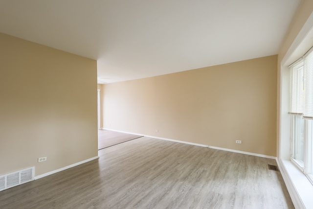 empty room with wood-type flooring