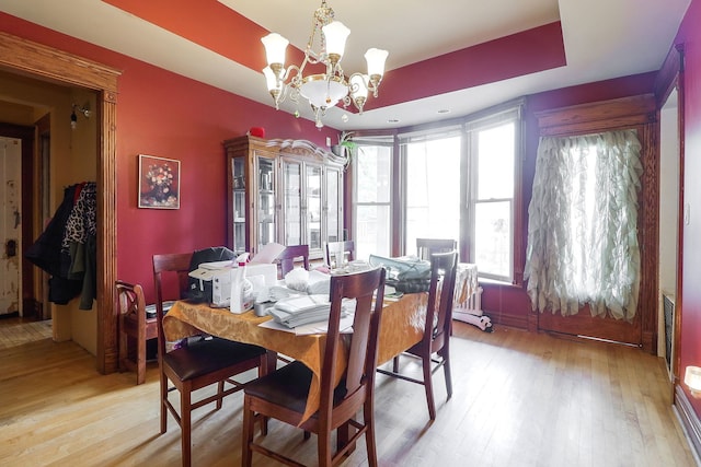 4533 Highland Ave, Downers Grove, IL 60515 - dining space with a chandelier, light wood finished floors, and a raised ceiling