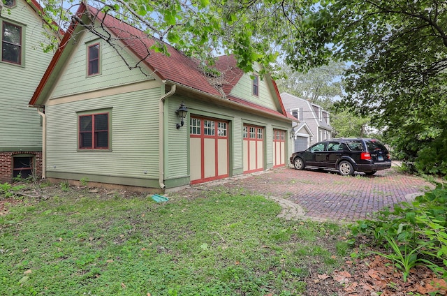 4533 Highland Ave, Downers Grove, IL 60515 - view of property exterior featuring a garage and driveway