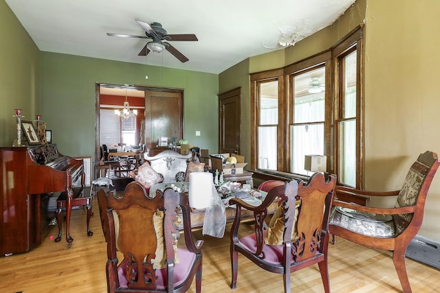 4533 Highland Ave, Downers Grove, IL 60515 - dining area featuring a chandelier, ceiling fan, and light wood-style flooring