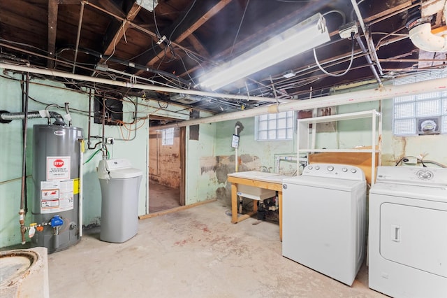 basement featuring gas water heater and independent washer and dryer