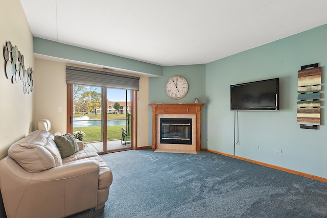 carpeted living room with a tile fireplace