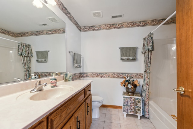 full bathroom featuring toilet, tile patterned flooring, vanity, and shower / tub combo