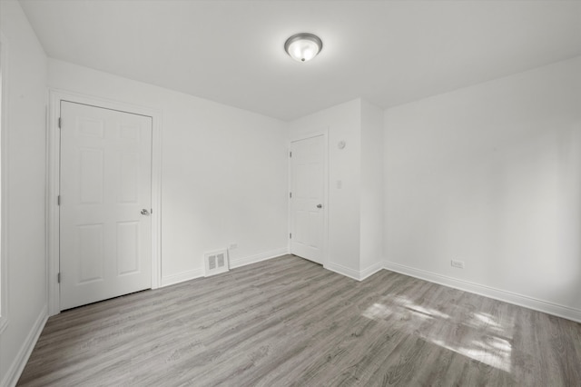 empty room with light wood-type flooring