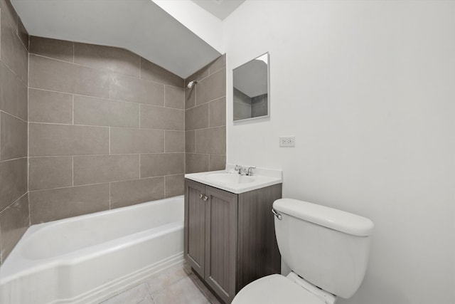 full bathroom with tiled shower / bath, vanity, toilet, and tile patterned flooring