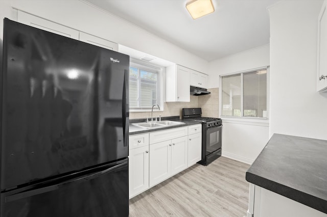 kitchen with white cabinets, backsplash, light hardwood / wood-style flooring, black appliances, and sink