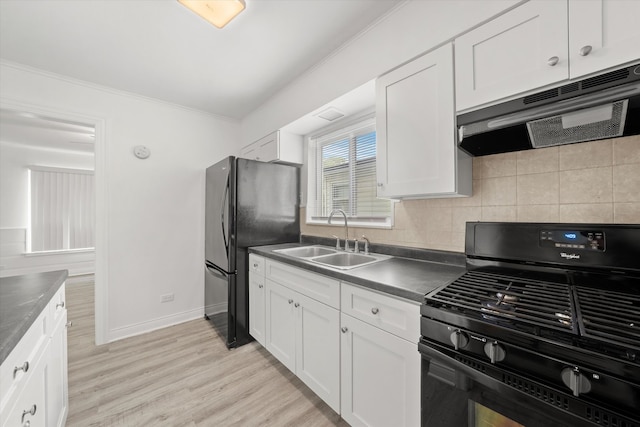 kitchen with sink, black appliances, white cabinetry, and light hardwood / wood-style floors