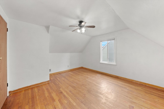 bonus room with light hardwood / wood-style floors, vaulted ceiling, and ceiling fan