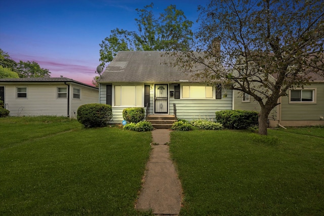 view of front of house with a yard