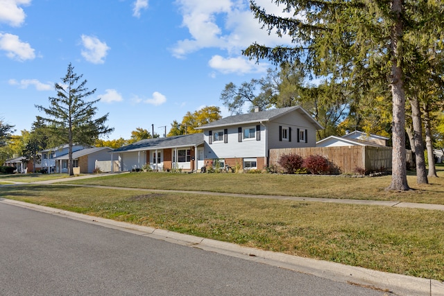 tri-level home featuring a front yard