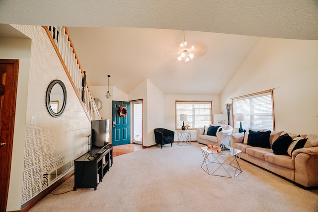 carpeted living room featuring high vaulted ceiling and a notable chandelier