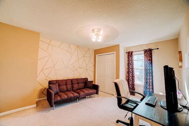 carpeted office featuring a textured ceiling and ceiling fan