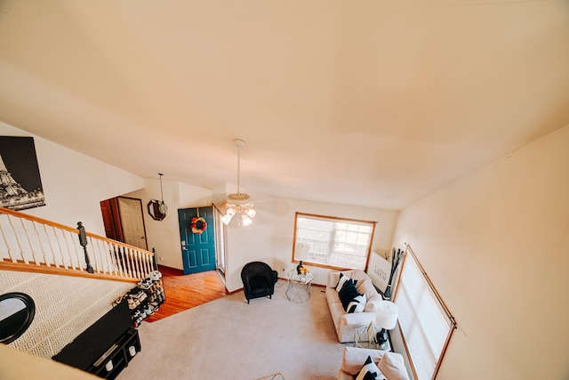 interior space featuring lofted ceiling and carpet flooring