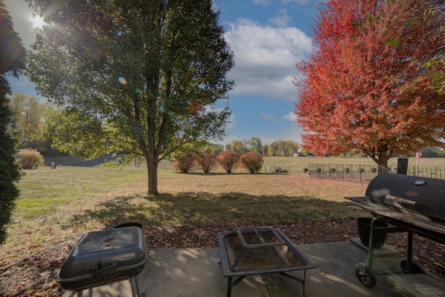 view of yard featuring a patio and a rural view