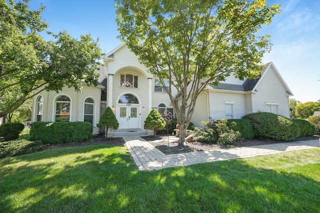 view of front of house featuring french doors and a front yard