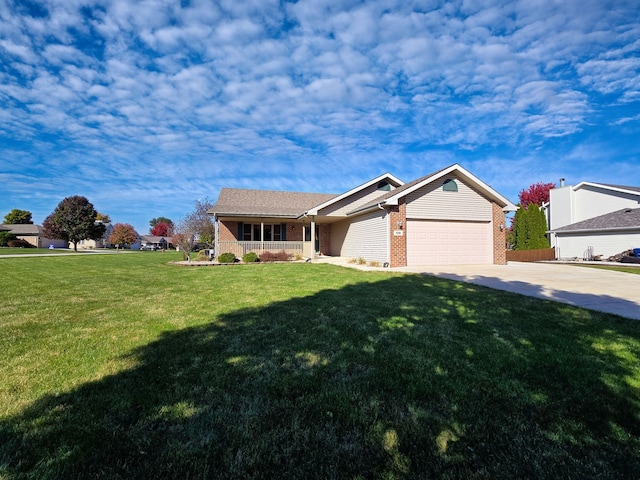 ranch-style home featuring covered porch, a front lawn, and a garage