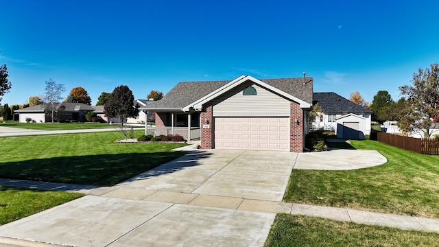 view of front of property with a front lawn and a garage