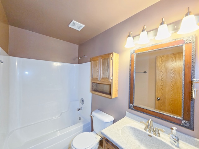 full bathroom featuring toilet, vanity, and bathing tub / shower combination