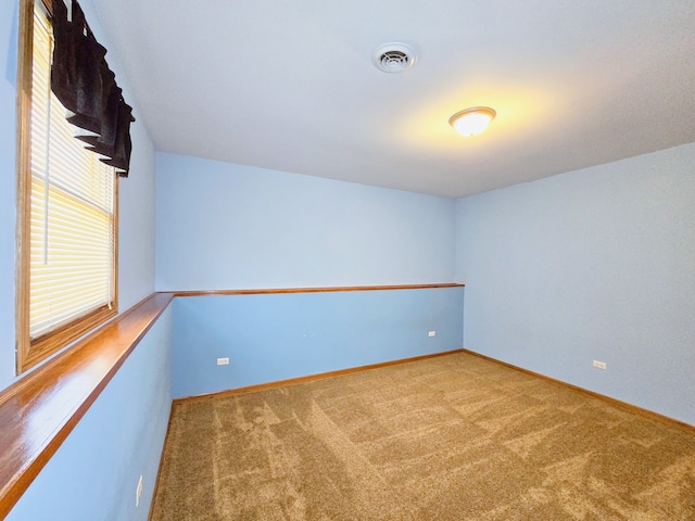 view of carpeted spare room