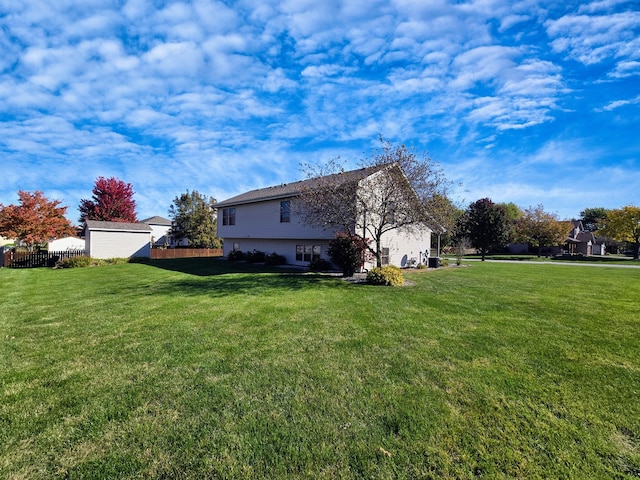 view of side of property with a yard