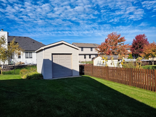 view of yard with an outbuilding and a garage