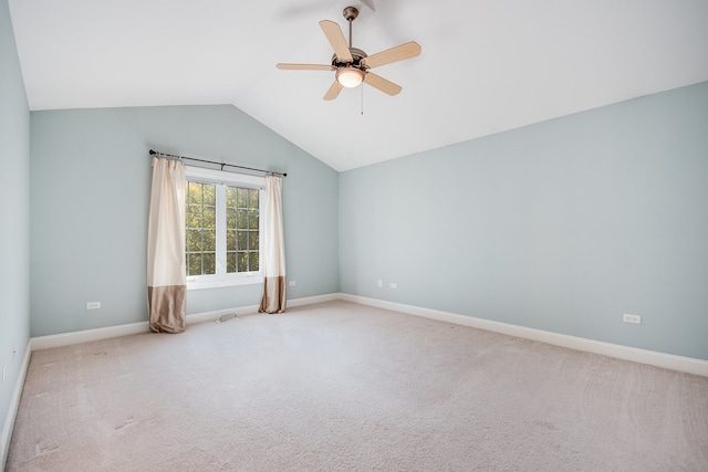 carpeted spare room with lofted ceiling and ceiling fan