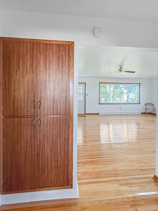 interior space featuring light hardwood / wood-style floors and ceiling fan