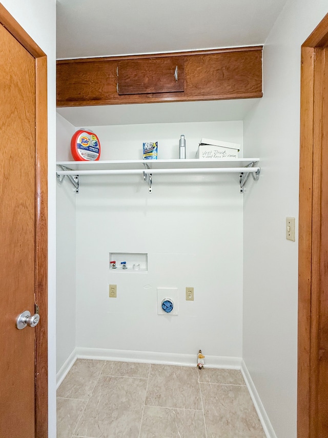 laundry area featuring hookup for an electric dryer, light tile patterned floors, hookup for a washing machine, and hookup for a gas dryer