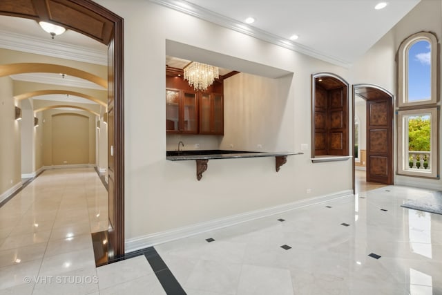 corridor featuring light tile patterned floors, crown molding, and a notable chandelier