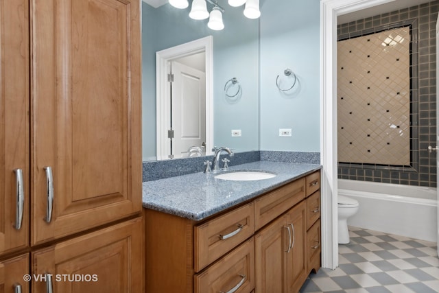 full bathroom with vanity, toilet, and tiled shower / bath