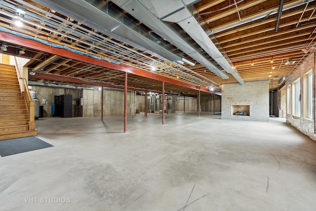 basement with a large fireplace