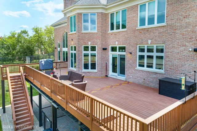 wooden terrace featuring area for grilling