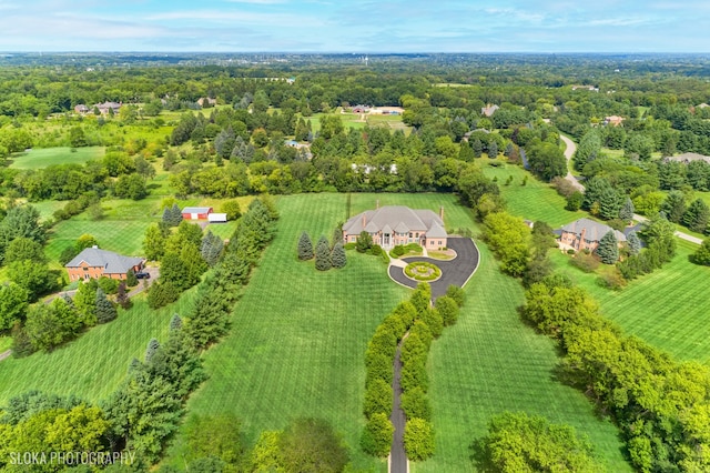 birds eye view of property with a rural view