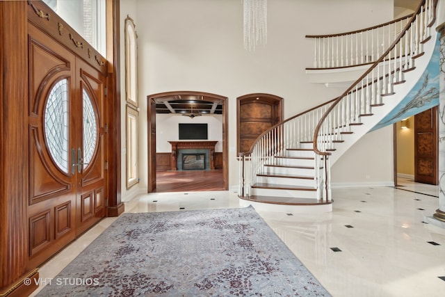 foyer featuring a towering ceiling