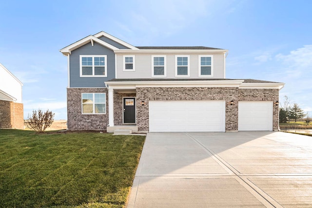 view of front of home featuring a front yard and a garage