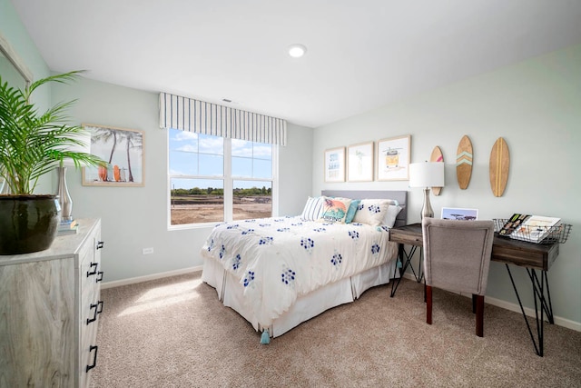 bedroom featuring light carpet