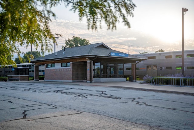 view of outdoor building at dusk