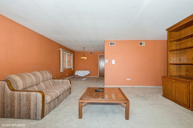 carpeted living room with a baseboard heating unit and an inviting chandelier