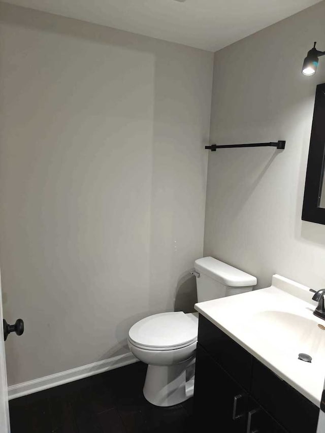 bathroom featuring vanity and toilet