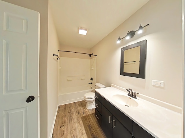 full bathroom with vanity, hardwood / wood-style flooring, toilet, and shower / bathtub combination