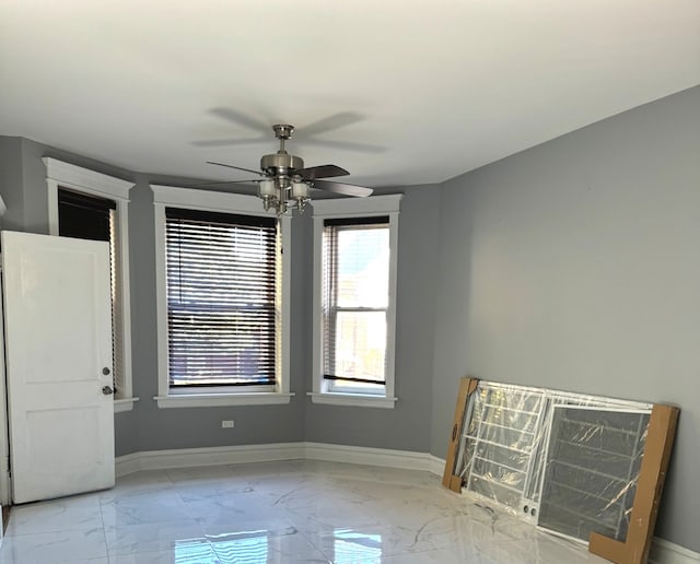 spare room featuring ceiling fan