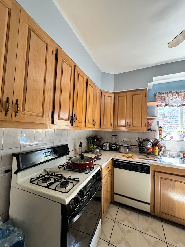 kitchen featuring tasteful backsplash, ceiling fan, and white appliances