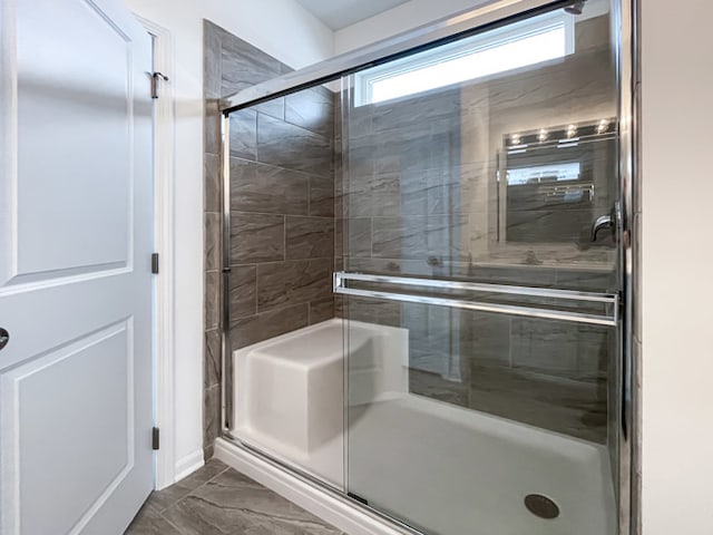 bathroom featuring walk in shower