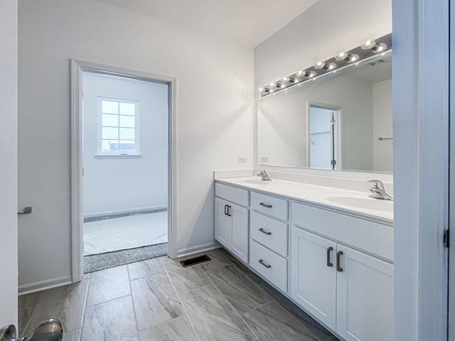 bathroom with vanity and a bathtub